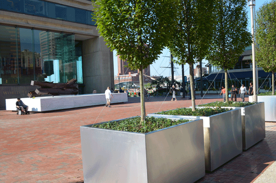 Stainless Steel Planters with remnants of one of the twin towers in the background