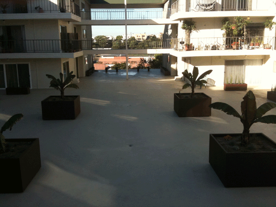 Large Cube Planters and bridge benches on a rooftop of a condominium complex