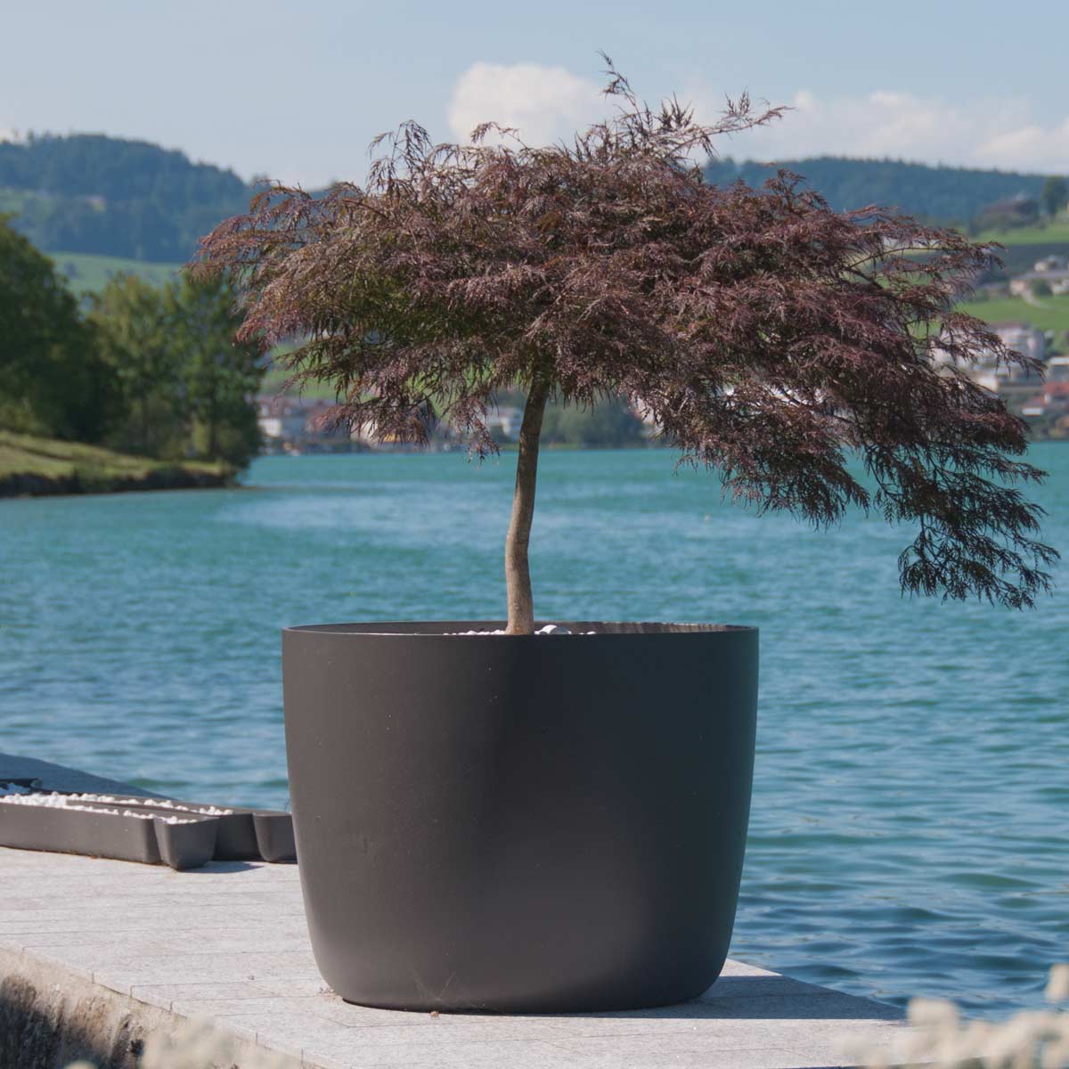 Fiber cement planters for outdoor living