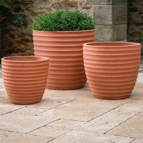 Campania international linea planters showing rounded vessel shape in terracotta for outdoor planting spaces