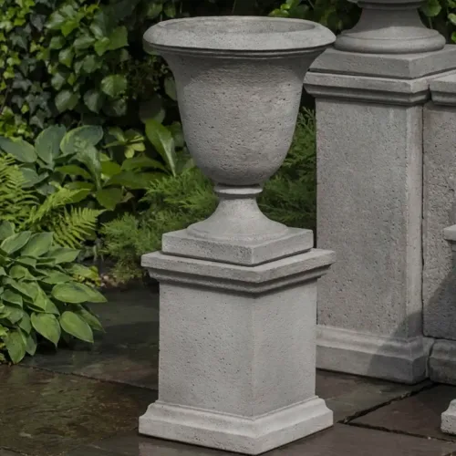 Linwood urn w/ low wolcott pedestal by campania international in cast stone, shown as an urn planter
