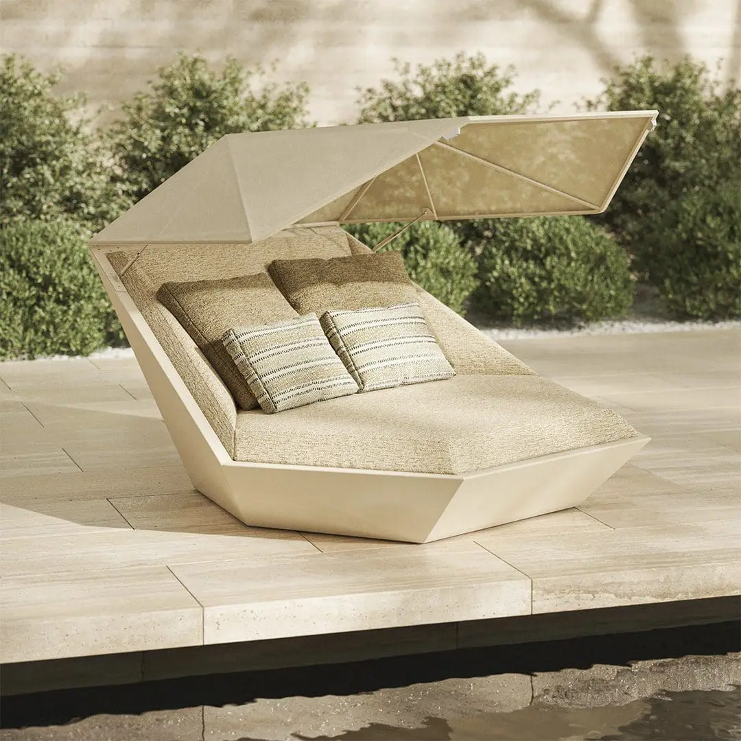 Vondom-Faz-Daybed-with-Parasol-in-daylight Outdoor daybed with parasol canopy and neutral cushions on a stone poolside terrace