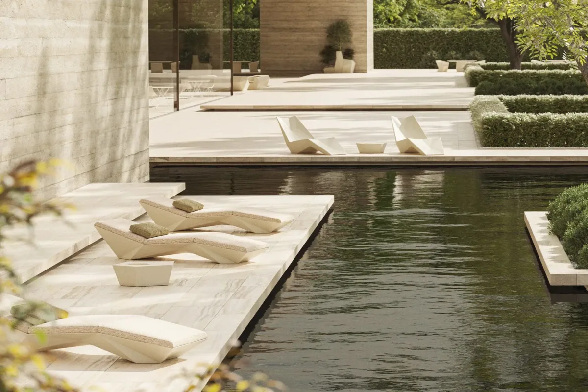 Vondom-Faz-Sun-and-Daybed-Line Geometric outdoor chaise loungers on a stone pool deck