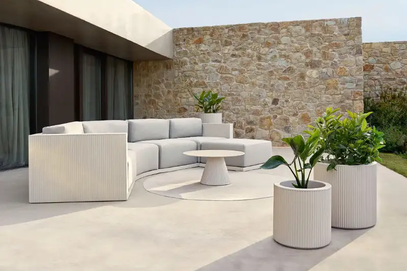 Vondom gatsby outdoor furniture arranged in luxury patio setting with modern landscaping and open air lounge design