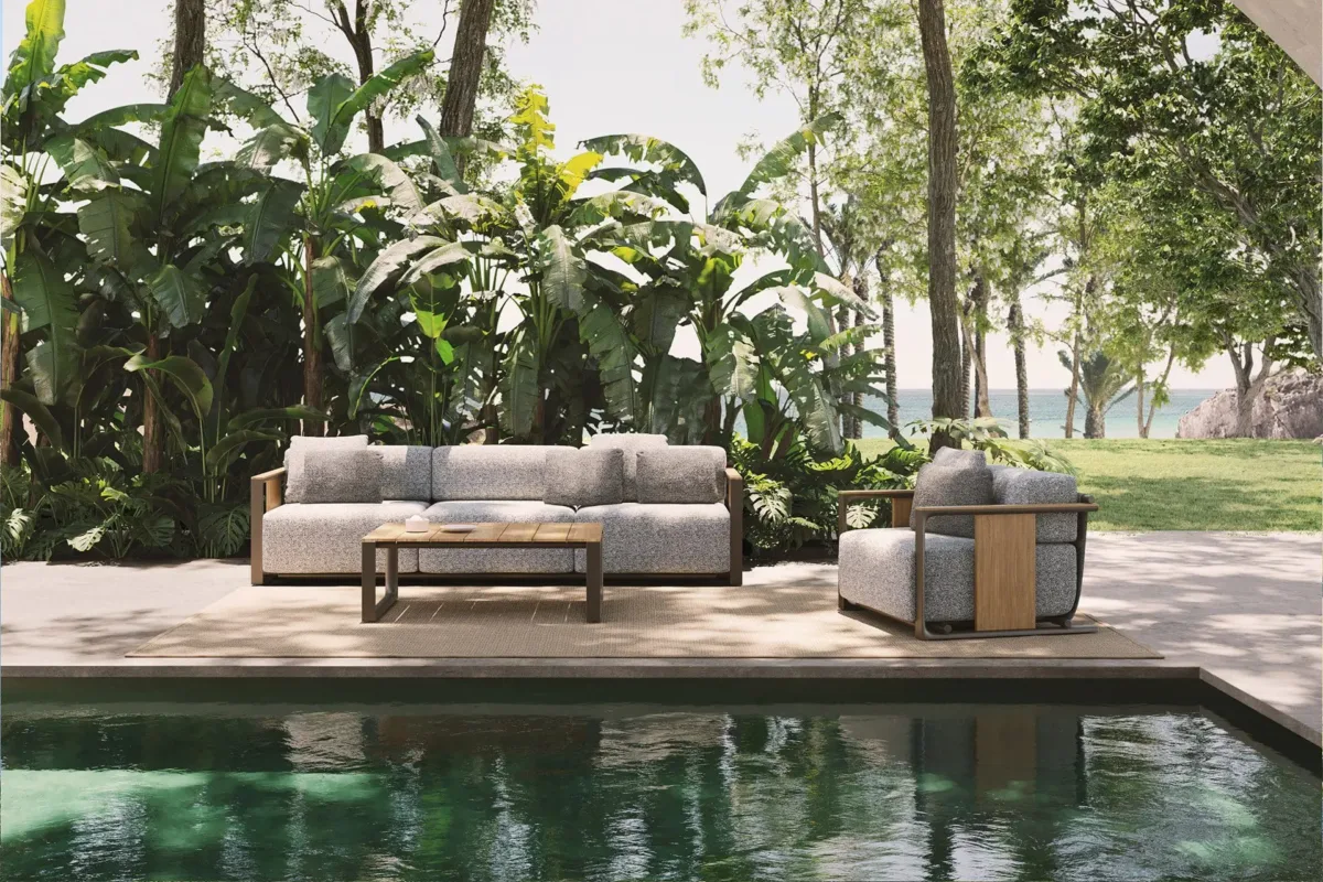 Vondom-Tulum-Collection Outdoor sofa and lounge chair with teak accents and aluminum frame arranged beside a pool
