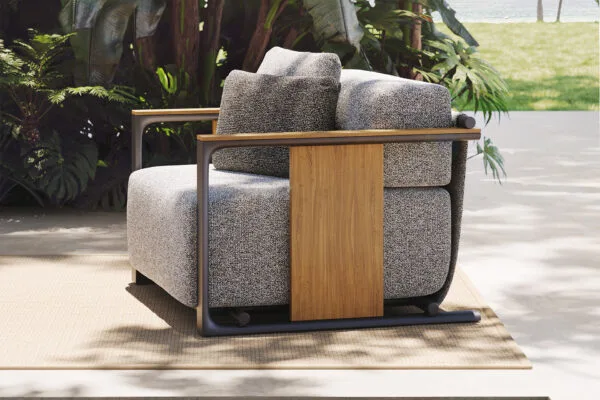 Vondom-Tulum-lounge-chair-detail Tulum lounge chair with teak side panel and plush cushions set in a tropical outdoor space